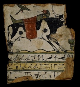 Fragment of coffin from the late Period. The mummy being transported by a bull and over him the ba bird flying. British Museum. Ancient Egypt.